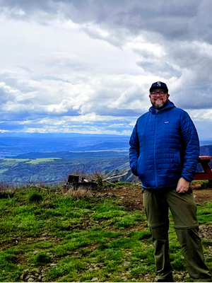 Photo of Brian Hamill on a mountain